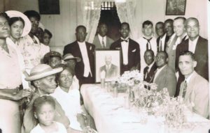 A picture of Peace Mission members and Navy veteran and Peace Mission member Philip Life, a conscientious objector who served in the Navy. He told Peace Mission members that he brought Divine’s message to the segregated military — and that a “Divine intervention” saved him from a Court Martial.